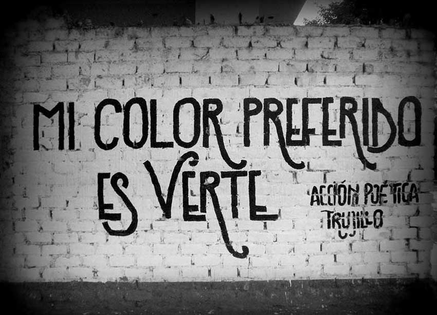 Muro pintado con la frase: Mi color preferido es verte. Acción poética Trujillo.